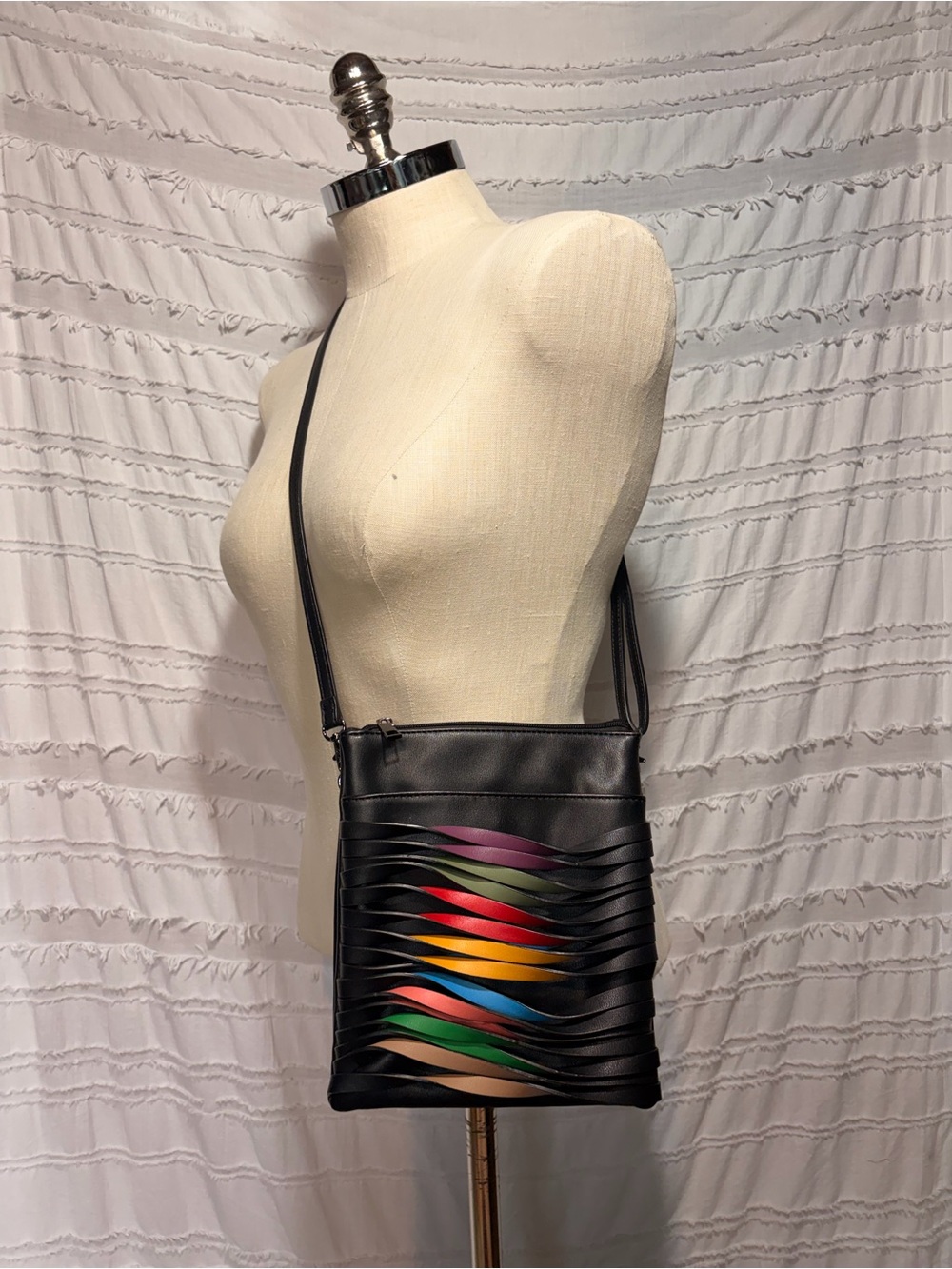 Mellow World Rainbow Twist Crossbody, faux leather.